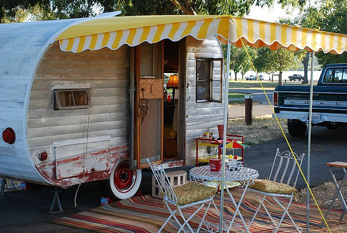 Vintage trailer set up at campsite